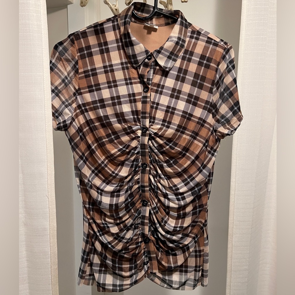 Beautiful elegant top. Great quality and helps shape body